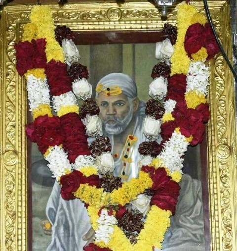 saiBaba Sitting in front of Dhuni Maa Color Photograph